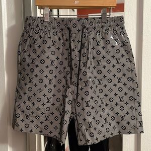 Brand new Louis Vuitton shorts W/mesh lining. Brand new with tags. Never worn.